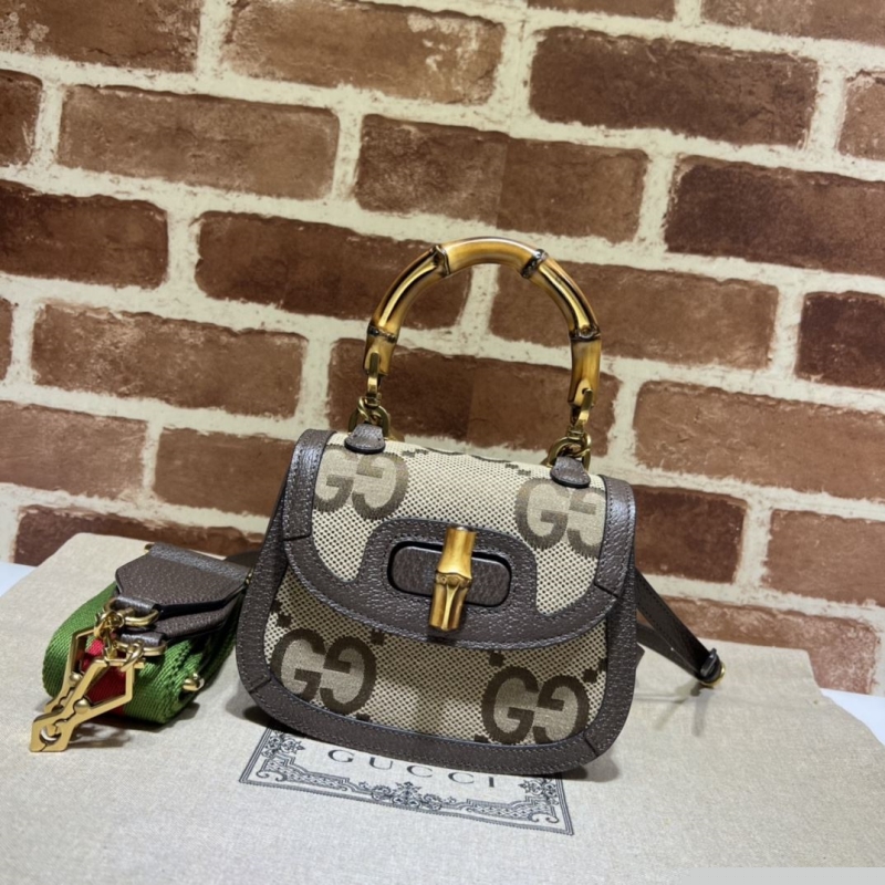 G*u*i top handle bags